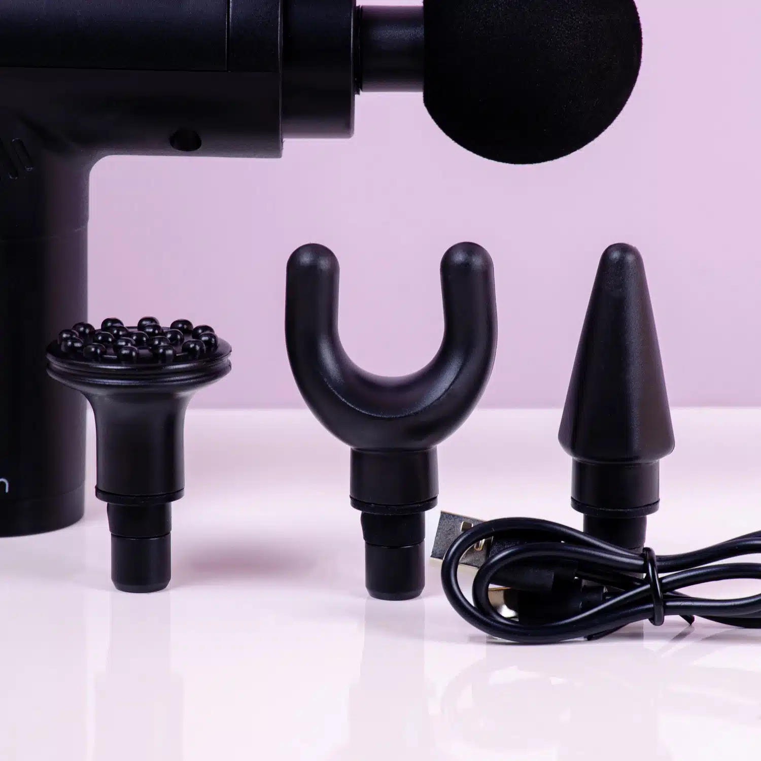 Massage gun met opzetstukken